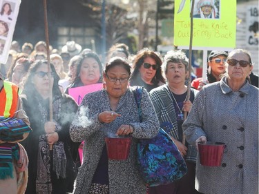 Marchers carry sweetgrass to the Sisters In Spirit ceremony for missing and murdered aboriginal women Monday October 5, 2015 in Eau Claire. Dozens walked from City Hall to Eau Claire in the 11th annual march and ceremony.