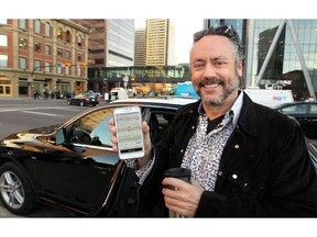 Calgary businessman and philanthropist Brett Wilson showed off the Uber app after catching a ride downtown as rider No. 1 during the morning rush hour.