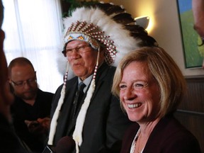 Premier Rachel Notley and Grand Chief Charles Weaselhead talk to media following a meeting at the McDougall Centre in Calgary on Friday, Oct. 15, 2015.