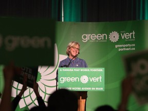 Green Party leader Elizabeth May, speaks to volunteers, campaign staff and supporters, after finding out she's been re-elected during election night at the Victoria Conference Centre in Victoria, B.C., Monday, October 19, 2015.