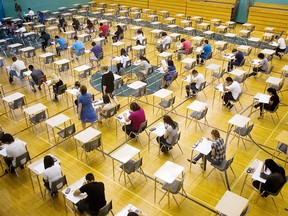 Students at Bishop McNally High School  write their biology 30 final exam in the school's gymnasium in June 2010 in Calgary.