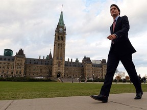 Justin Trudeau makes his way from Parliament Hill to the National Press Theatre to hold a press conference in Ottawa on Tuesday, Oct. 20, 2015.
