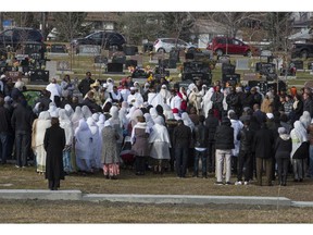 More than 100 people gathered at Queen's Park Cemetery to mourn the death of Selamawit "Selma" Alem in Calgary, on October 25.