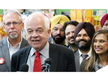 Flanked by Calgary Liberal candidates Liberal candidate for Markham-Thornhill John McCallum holds a press conference about the Liberal plan for Canadian immigration and economic opportunity at the Sanjha Punjab Grocery in northeast Calgary on Tuesday September 29, 2015.