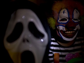 Children get ready for Halloween for the traditional trick-or-treat practice in Santiago.