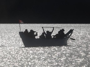 A 40 foot Spirit Dancer canoe on a sunset paddle around Glenmore Reservoir at sunset Wednesday October 7, 2015. The paddlers are local canoe and outdoor enthusiasts and member of the Bow Waters Canoe Club. The canoe was built by Clipper in Abbotsford, BC with funds raised by Calgarians and is destined for the Canadian Canoe Museum in Peterborough, Ontario.