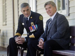 Duffy Pruyn chats with Fire Chief Steve Dongworth Thursday Oct. 8, 2015 following the Calgary Fire Department Recognition Luncheon at Heritage Park. Pruyn was honoured for his role in an aquatic rescue after a car crashed into a pond.