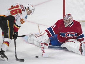 Montreal Canadiens goaltender Carey Price is scored on by Calgary Flames' Josh Jooris during first period NHL hockey action in Montreal, Sunday, November 2, 2014.