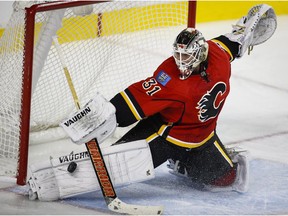 Calgary Flames goalie Karri Ramo, from Finland, makes a save during second period NHL hockey action against the Washington Capitals in Calgary, Tuesday, Oct. 20, 2015.