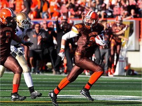 St. Francis Browns' Jacob Geremia looks back after out-sprinting his Notre Dame Pride pursuers as he runs in for a touchdown during the squads' high school football clash of the titans at McMahon Stadium on Friday. St. Francis won 31-10, handing Notre Dame its first loss since 2011.