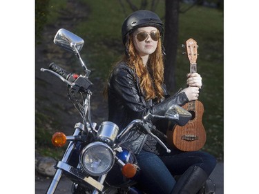 Motorcycle riding, ukelele strumming, Allison Lynch plays "bad ass 14 year old Juliet" in the Shakespeare Company  prodcution of Romeo and Juliet. She is pictured with her ride in Lower Mount Royal Tuesday September 29, 2015.