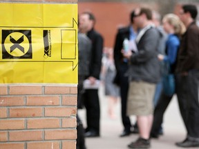 Voters line up at a federal election polling station at St. Mary's Hall in the riding of Calgary Centre in southwest Calgary on Monday, May 2, 2011.