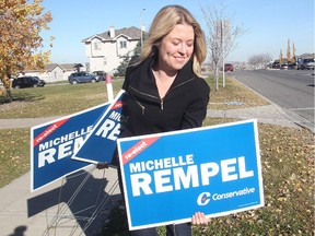 Michelle Rempel, victorious in Calgary Nose Hill, gathers her federal Conservative elections signs in the Panorama Hills area on  Oct. 20, 2015.