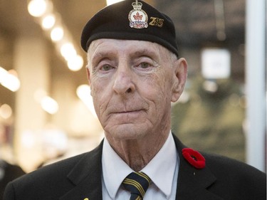 Allan McMillan, Colour Party and Honour Guard, grins at the start of the poppy fund parade at Chinook Mall in Calgary, on October 31, 2015.