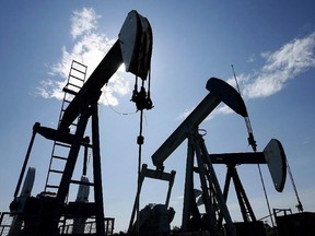 Pumpjacks at work pumping crude oil near Halkirk, Alta., June 20, 2007. With Canada's premiers poised to meet next week in Quebec City to discuss energy strategy and climate change, forces are girding for battle - with Alberta's oilsands the figurative no-man's land that lies between the warring world views. THE CANADIAN PRESS/Larry MacDougal ORG XMIT: POS1504091448530623

0519-biz-xFPfracklog