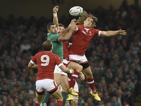 Canada's wing Jeff Hassler, right, jumps for the ball during a Pool D match of the 2015 Rugby World Cup between Ireland and Canada on Sept. 19. He hasn't played since, but will draw back in against Romania on Tuesday.