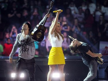 Members of the Band Perry performed to the crowd during WE Day in Calgary at the Scotiabank Saddledome on October 27, 2015.