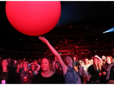 Fans bat large balloons through the crowdas Paul Brandt takes the stage Friday night October 2, 2015 at the Saddledome as part of the Road Trip with Dean Brody.