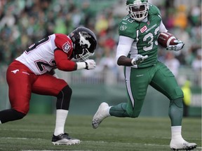 Saskatchewan Roughriders running back Jerome Messam shakes a tackle during an Aug. 22 game against the Calgary Stampeders. The Stamps landed the power back in a trade on Wednesday.