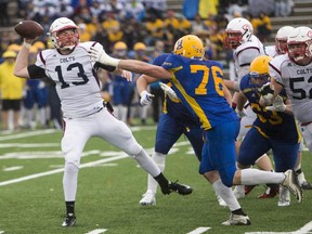 Calgary Colts quarterback John Kiesman is able to get a pass away as  Saskatoon Hilltops defensive linemen Connor Guillet put-on some pressure in action last Sunday. After upsetting the Hilltops and preventing them from having an undefeated season, the Colts are riding high into Sunday's PFC semifinal in Regina against the Thunder.