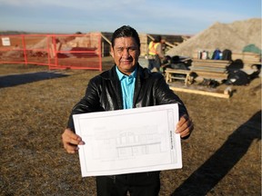 Nelson Breaker holds the blueprints of his new home at the site on Siksika Nation, Oct. 22, 2015. This is the first private financed home on the Nation as part of the new Home Ownership Fund under the Kelowna Accord.