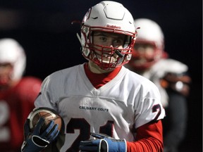 Calgary Colts running back Dylan Minshull ran through plays during the Colts practice at the Edge School on October 22, 2015 in advance of PFC final against Saskatoon this weekend.