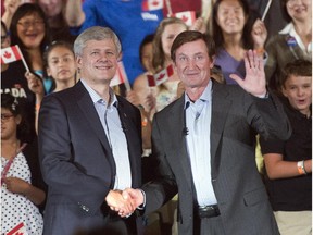 Stephen Harper shakes hands with Wayne Gretzky during a campaign event in September.