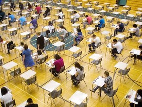 Students write an exam in this file photo.