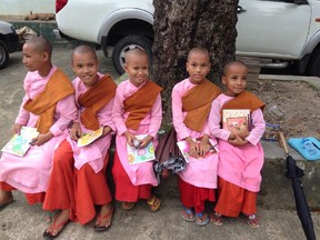 Students at the Aung Myay Thukha monastery school in Yangon, Myanmar enjoy new notebooks and pens, part of a support program with Trafalgar.