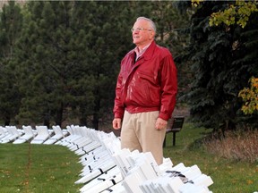 Murray McCann, founder of the Field of Crosses memorial project, which started in 2009, stands amid the crosses in Calgary in this 2015 file photo.
