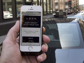 The ride-sharing app Uber is shown on a smartphone in Montreal on May 14, 2015.