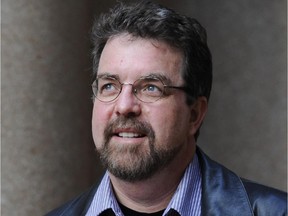 VANCOUVER. OCTOBER 04 2012. Will Ferguson poses for a photo outside the Central branch of the Vancouver library,  Vancouver, April 04 2012.  He takes readers behind the scenes of the worlds most insidious Internet scam in 419, a novel Gerry Kahrmann /  PNG staff photo) For Sun News [PNG Merlin Archive]