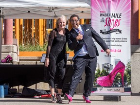 Sue Tomney, YWCA CEO, with Calgary Mayor Naheed Nenshi at the 10th annual Walk a Mile in Her Shoes fundraiser on Sept. 17. The event raises awareness of domestic violence is one of several innovative fundraisers the YW runs each year.