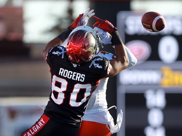 Stamps Eric Rogers gets tangled yp with Lions T.J.  Lee and the ball feel to the ground in the first half. The Calgary Stampeders hosted the B.C. Lions in the CFL's West Division semifinal on November 15, 2015 at McMahon Stadium.