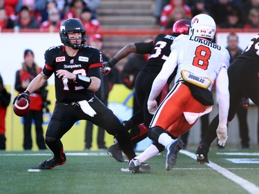 Stamps quarterback Bo Levi Mitchell looks for a play in the first half. The Calgary Stampeders hosted the B.C. Lions in the CFL's West Division semifinal on November 15, 2015 at McMahon Stadium.