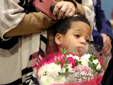 Jakeim,5, waits with his mom for first group of Syrian refugees to arrive at the Calgary International Airport on Nov. 23, 2015.