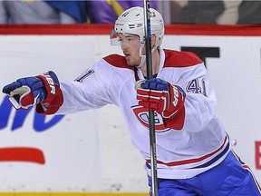 Montreal Canadiens forward Paul Byron celebrates after a goal by Devante Smith-Pelly against the Calgary Flames during NHL hockey in Calgary on Oct. 30, 2015.