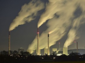 FILE - In this Nov. 24, 2014 file photo, smoke streams from the chimneys of the E.ON coal-fired power station in Gelsenkirchen, Germany. The U.N. weather agency says levels of carbon dioxide and methane, the two most important greenhouse gases, reached record highs last year. Pushed by the burning of coal, oil and gas for energy, global CO2 levels are now 143 percent higher than before the industrial revolution and scientists say thatís the main driver of global warming. (AP Photo/Martin Meissner, File)