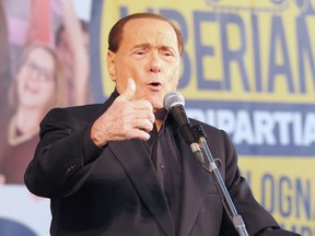 The leader of center-right party Forza Italia (FI), Silvio Berlusconi delivers a speech during a rally with Italian Lega Nord (Northern League) Secretary, on November 8, 2015 in central Bologna. Former center right premier Silvio Berlusconi said on November 5, 2015 he will gladly attend a rally organized by the rightwing, anti-immigrant Northern League (LN) at the weekend.   AFP PHOTO / GIANNI SCHICCHIGIANNI SCHICCHI/AFP/Getty Images