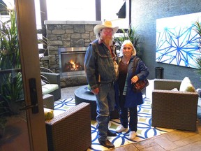Hospital Home Lottery winners Jim and Brenda Rattai, of Vulcan, stand in the outdoor livingroom in their new $2.3 million home by Calbridge Homes on the gated island in the community of Mahogany. As part of the grand prize awarded Nov. 6, 2015, they also received $50,000 and maid service for one year.