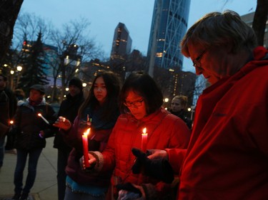 Calgarians attend a candlelight vigil for the victims of the terrorist attack in Paris. The vigil took place outside City Hall in Calgary on Saturday night November 14, 2015.