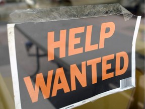 A help wanted sign hangs on the window of Gino's Pizza in Miami Beach, Florida, Friday, August 5, 2005. U.S. employers added 207,000 workers in July, a bigger increase than forecast, and wages grew at the fastest pace in a year, suggesting companies are gaining confidence as the economy picks up speed. Photographer: Mike Fuentes/Bloomberg News *CALGARY HERALD MERLIN ARCHIVE*