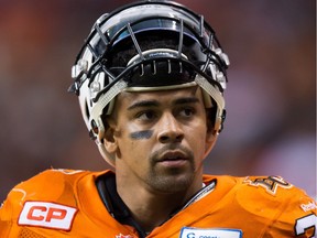 B.C. Lions' Andrew Harris takes a break on the sideline between offensive plays during the first half of a CFL football game against the Toronto Argonauts in Vancouver, B.C., on Friday July 24, 2015.