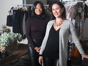 Tracy Fu, left, and Erin Ferguson, co-owners of [pre] shrunk, online consignment store, with some of their products.