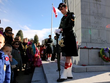 A Member of the Calgary Highlanders honour guard stands guard at the cenotaph during the annual Remembrance Day ceremony at Central Memorial Park.
