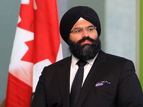 Manmeet Bhullar at an announcement at Bow Valley College in Calgary on April 24, 2014. Bhullar died in a crash on Highway 2 in November 2015.