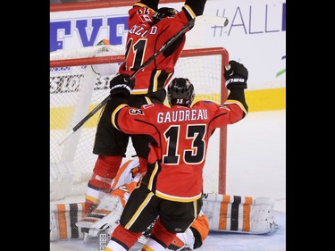 Calgary Flames forward Mikael Backlund scores the overtime winning goal on the Flyers' Michal Neuvirth winning the game 2-1 at the Scotiabank Saddledome on Thursday Nov. 5, 2015