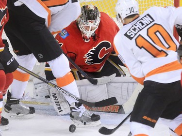 The Philadelphia Flyers put the pressure on Calgary Flames goaltender Karri Ramo during the first period of NHL action at the Scotiabank Saddledome on Thursday Nov. 5, 2015
