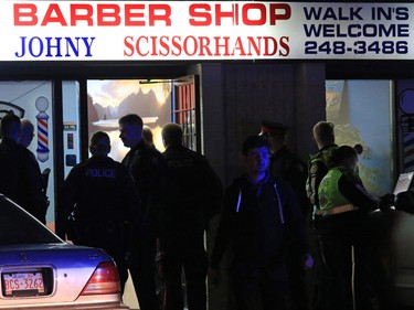 Police deal with a fatal shooting in a strip mall at 20th avenue and 52nd street S.E. on Saturday night November 14, 2015.