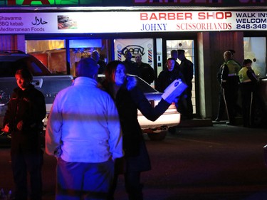 Police deal with a fatal shooting in a strip mall at 20th avenue and 52nd street S.E. on Saturday night November 14, 2015.